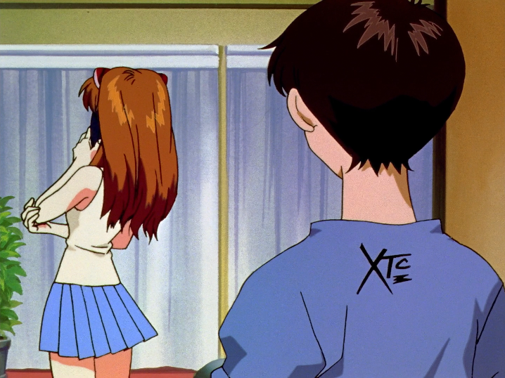 shinji from neon genesis evangelion turned away from camera, with small xtc logo on back of shirt